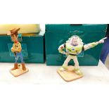 A collection of boxed Walt Disney figures: Buzz lightyear and Woody (2)