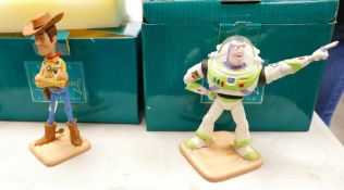 A collection of boxed Walt Disney figures: Buzz lightyear and Woody (2)