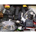 A collection of film camera parts including Lens, filters, flashes,hoods etc