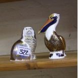 Royal Crown Derby paperweights: to include brown pelican together with a seated dog( no stoppers)