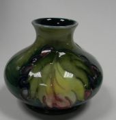 Moorcroft Leaf and berry design small squat vase: height 4cm