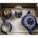 Wedgwood dipped blue jasperware: teapot, milk jug, lidded jug and lidded sugar bowl (4).