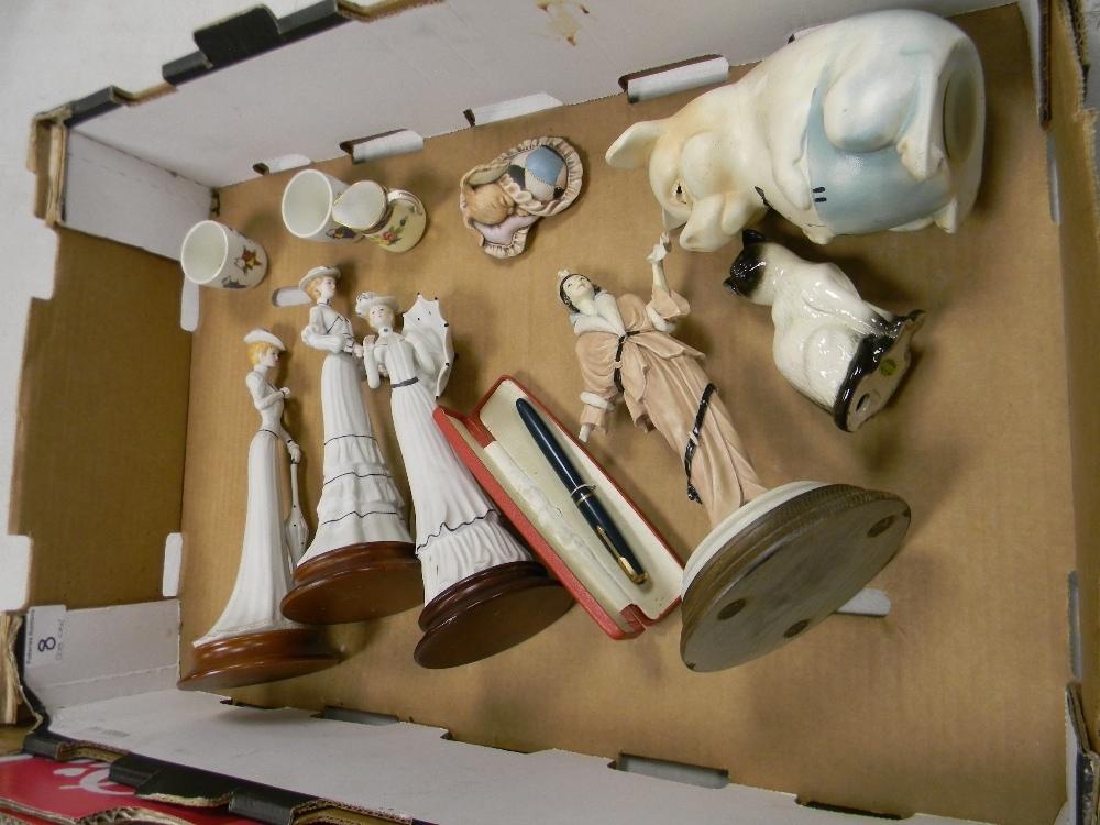 A mixed collection of items to include: ceramic lady figures, damaged Beswick cat, parker pen etc