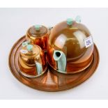 An English made copper and ceramic tea service on copper tray.