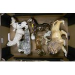 A collection of pottery animals to include: Polar Bears, Tigers, Horses , Dogs etc