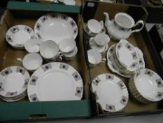 A collection of gilded tea and dinner ware: to include dinner plates, side plates, teapot, etc 57