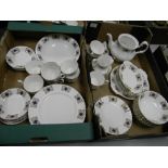 A collection of gilded tea and dinner ware: to include dinner plates, side plates, teapot, etc 57