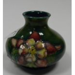 Moorcroft Orchid design small squat vase: height 4cm