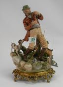 Large Capodimonte figure of fisherman: on brass base. Height 34cm