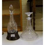 Crystal ships decanter: together with a round bottom decanter with wooden holder (2)