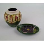 A Moorcroft 'candle glow' pattern vase 9cm: together with a clematis pattern pin tray (2).