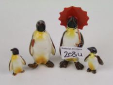 Beswick penguin with umbrella 802: penguin with walking stick 803 and 2 penguin chicks (4).