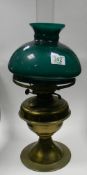 Brass oil lamp: with green shade. Height 52cm