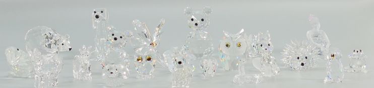 A collection of small Swarovski Crystal items to include: Art Deco dog, Dogs, Hedgehog, Birds,