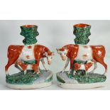 Pair of 19th Century Staffordshire Pottery spill vases: In the form of Hereford cow & calf (neck to