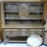 20th century Elizabethan style Oak dresser: 3 drawer base with plate rack,