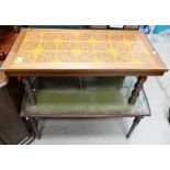 A pair of mid-century tables to include: one with a tiled top and brass corner mounts and one with