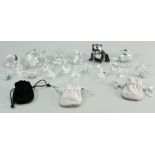 A collection of small Swarovski Crystal items to include: Pin Brooches, Shell, Panda, Pigs,