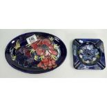 Moorcroft Anemone on blue ground: ashtray and shallow platter,