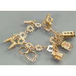 9ct gold charm bracelet: Seven charms (1 not gold), gross weight 21.