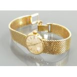 18ct gold Omega ladies wrist watch on 18ct bracelet: Weight 37.3 grams gross.