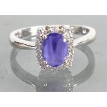 14ct white gold diamond & blue stone ring: Weight 3.3g, size R, 2 diamonds missing.