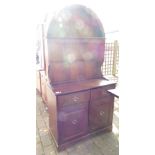 Dark wood oval topped dresser: