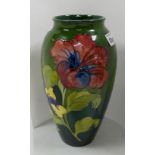 Moorcroft large Hibiscus vase: On a green to blue ground. Walter Moorcroft in green to base.