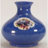 William Moorcroft vase decorated with floral panels on powder blue ground: Height 18cm.