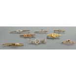 Three older 9ct gold brooches one silver & four gold plated: