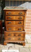 Reproduction miniature walnut chest on chest of drawers: