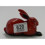 Royal Doulton Flambe rabbit lying down.