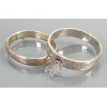 Two hollow silver hallmarked bangles: Very minor denting noted on both, weight 33.8g.