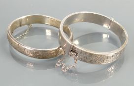 Two hollow silver hallmarked bangles: Very minor denting noted on both, weight 33.8g.