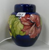 Moorcroft Hibiscus ginger jar: on blue ground. Signed with paper label inside lid.