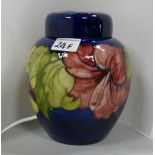 Moorcroft Hibiscus ginger jar: on blue ground. Signed with paper label inside lid.