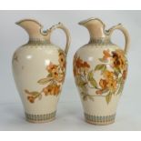 Pair Doulton Lambeth Ewers: Decorated with autumn flowers and leaves, initialled FM to the base,