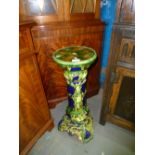 Majolica style green glazed jardinière stand, quantity of chess pieces and two dresses