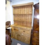 Old stripped pine kitchen dresser with rackback