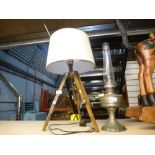 Tripod mounted table lamp with oil lamp