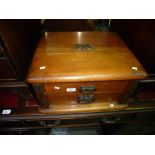 Antique oak two drawer canteen and a small amount of cutlery.