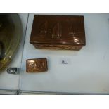 Newlyn copper cigarette box decorated with fish and boats and a similar matchbox cover