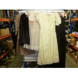 Selection of vintage dresses and furs.