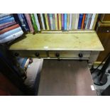 A waxed pine 2 drawer dressing table with a waxed pine bookshelf.