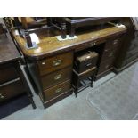 A Mahogany knee hole desk with 7 drawers
