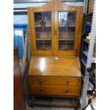 Vintage oak bureau bookcase with fitted interior with two drawers.