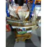 Wooden commode with ceramic bowl, box of medals and wooden model ship