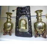 A pair of Chinese brass vases decorated dragons and a Chinese bell in carved hardwood stand