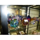 Collection of 11 Caithness glass paperweights, tallest 11.5cm high