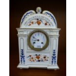 A J.W.Benson early 20th century pottery mantle clock having enamel dial, height 32cms.